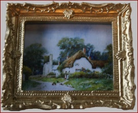 P018 A Gold Framed Picture of a Cottage